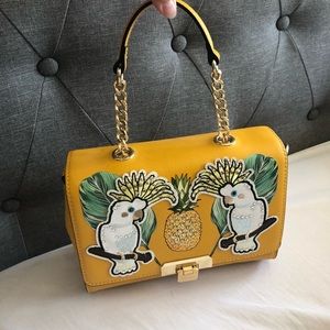 ALDO yellow pineapple bag.